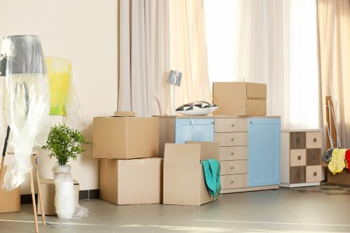 Man And Van Brent moving team using safety equipment during a house move