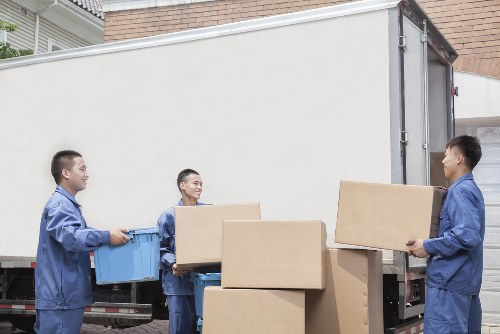 Student removal van loading boxes in Brent