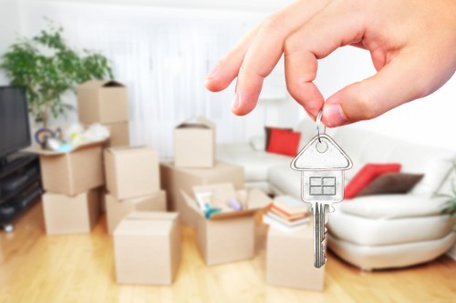 House removals team organising furniture and boxes for a move in Brent