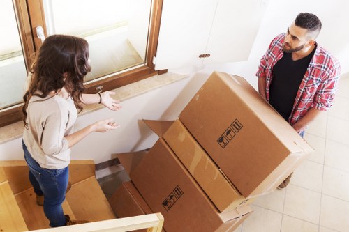 Professional movers preparing items in a Brent flat