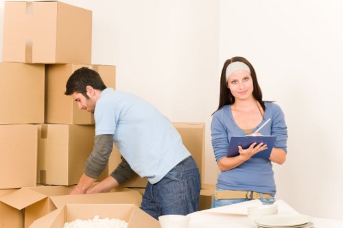 Moving team handling furniture and boxes during a Brent relocation