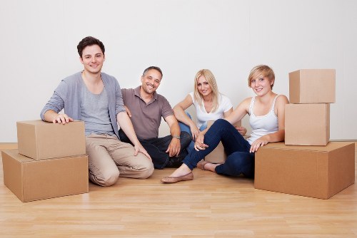 Professional movers handling stairs and access challenges in a Brent flat move